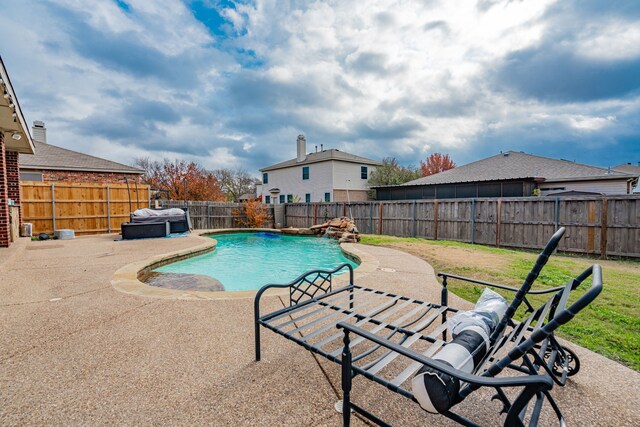 view of swimming pool featuring a patio