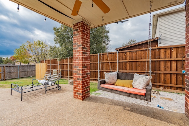 view of patio featuring ceiling fan