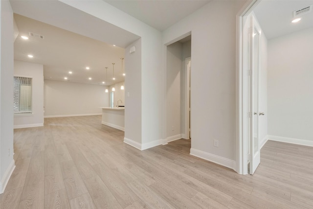 interior space with sink and light hardwood / wood-style floors