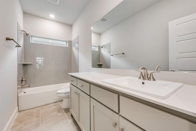 full bathroom with tile patterned floors, vanity, toilet, and tiled shower / bath