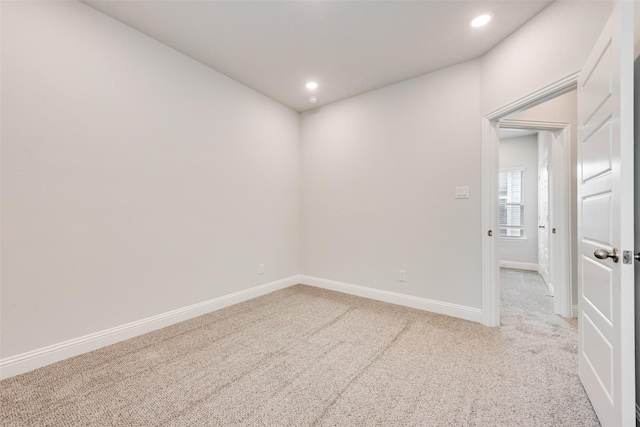 empty room with light colored carpet