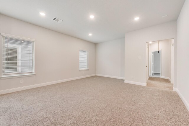 empty room featuring light colored carpet