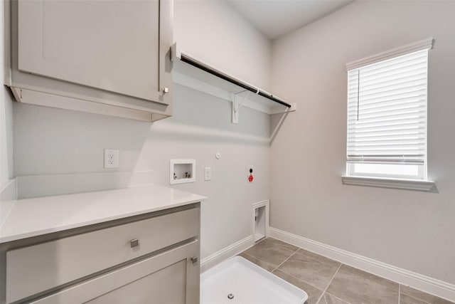 clothes washing area with hookup for a washing machine, gas dryer hookup, plenty of natural light, and hookup for an electric dryer