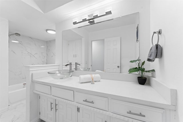 bathroom featuring vanity and tiled shower / bath combo