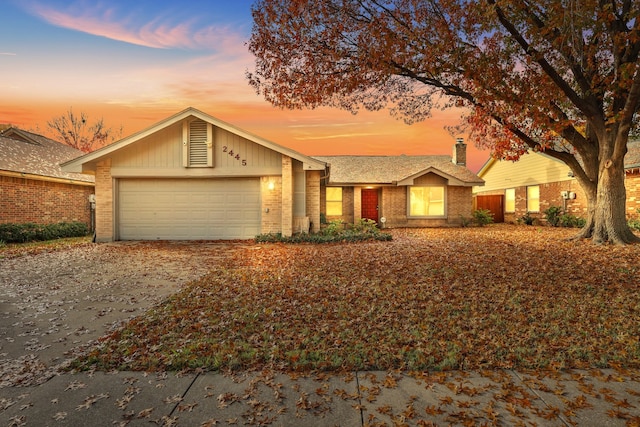 ranch-style house featuring a garage