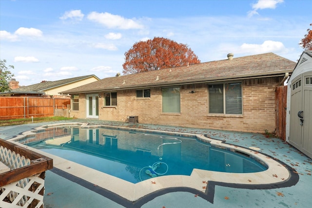 view of swimming pool featuring french doors