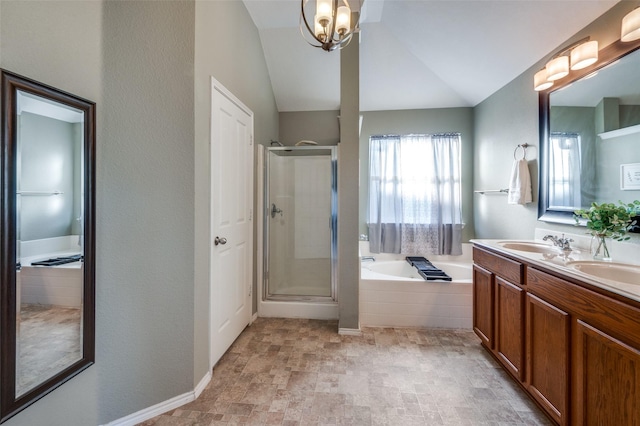 bathroom featuring vanity, a chandelier, plus walk in shower, and vaulted ceiling