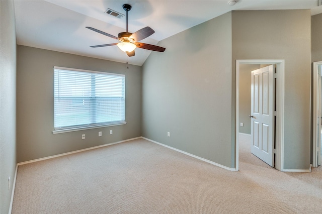 unfurnished room with light carpet, ceiling fan, and lofted ceiling