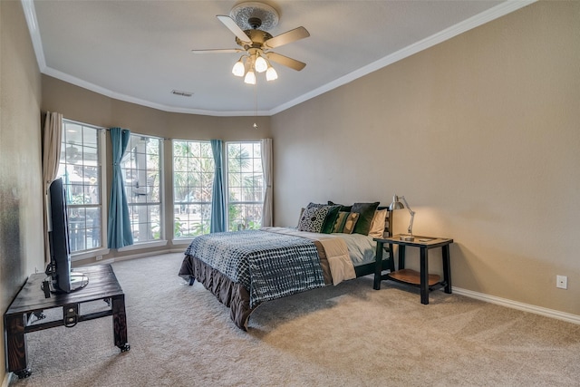 carpeted bedroom featuring ceiling fan and ornamental molding