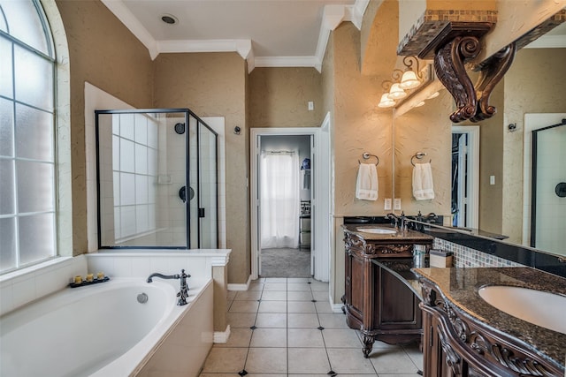 bathroom with tile patterned floors, a healthy amount of sunlight, crown molding, and separate shower and tub