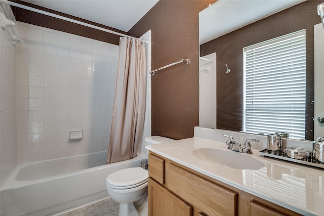 full bathroom featuring tile patterned floors, plenty of natural light, vanity, and toilet