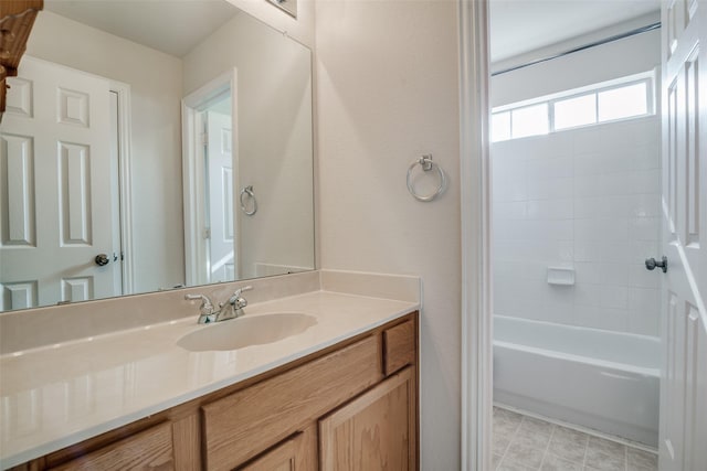 bathroom featuring bathtub / shower combination and vanity