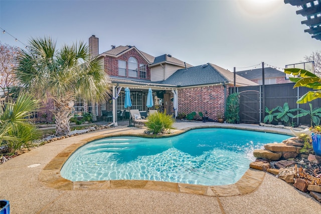 view of swimming pool with a patio