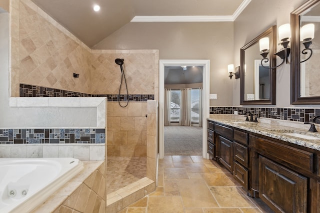 bathroom featuring vanity, lofted ceiling, independent shower and bath, and crown molding