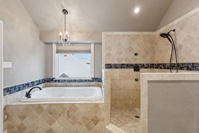 bathroom featuring vaulted ceiling, independent shower and bath, and a notable chandelier