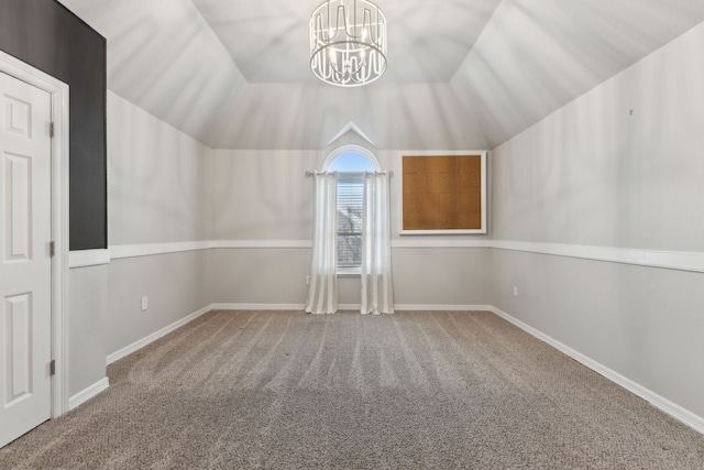 additional living space featuring vaulted ceiling, carpet floors, and an inviting chandelier