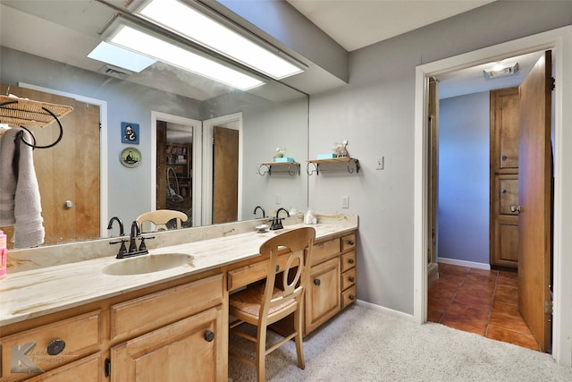 bathroom featuring vanity and tile patterned flooring