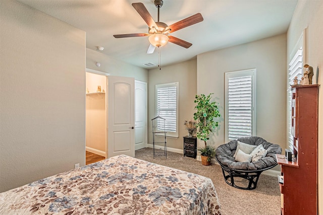 bedroom featuring visible vents, baseboards, ceiling fan, and carpet flooring