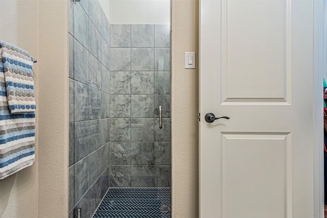 full bathroom featuring a stall shower