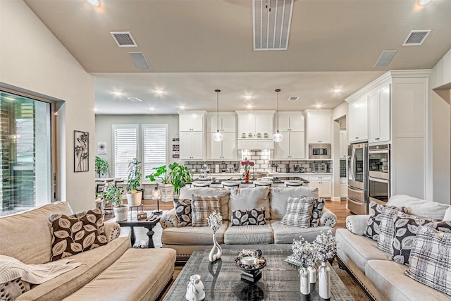 1507 Viridian Park Ln, Arlington, TX 76005 - living room with light wood finished floors, recessed lighting, and vaulted ceiling