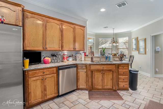 kitchen featuring pendant lighting, crown molding, appliances with stainless steel finishes, backsplash, and light stone counters