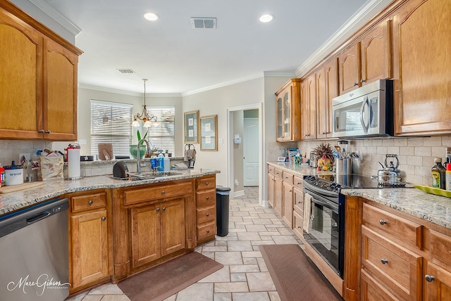 kitchen with sink, backsplash, ornamental molding, light stone counters, and stainless steel appliances