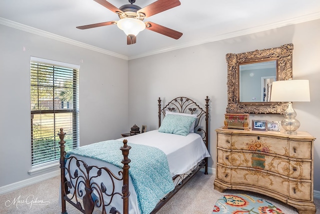 bedroom featuring crown molding, light colored carpet, and ceiling fan