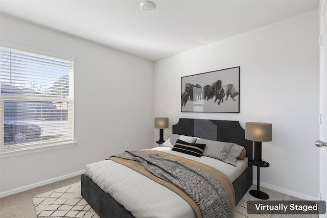 bedroom with light colored carpet