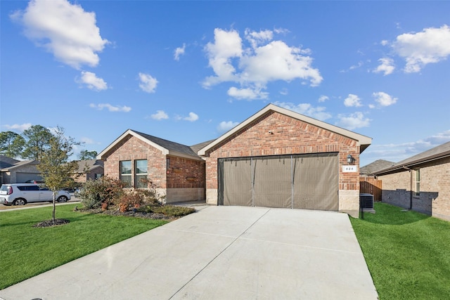 view of front of property featuring central AC, a front yard, and a garage