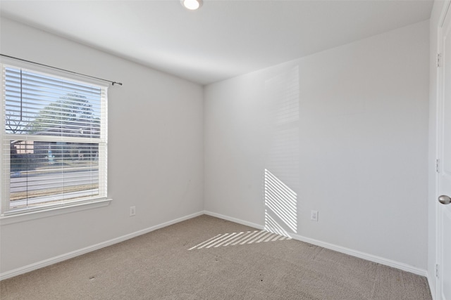 empty room with light colored carpet