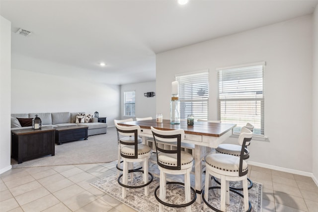 dining room featuring plenty of natural light and light tile patterned floors