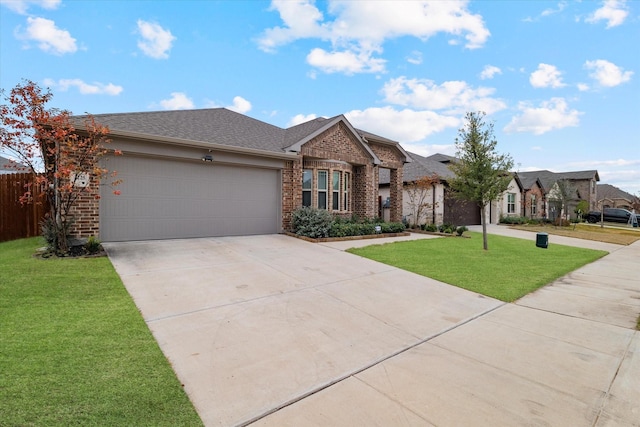 single story home with a garage and a front lawn