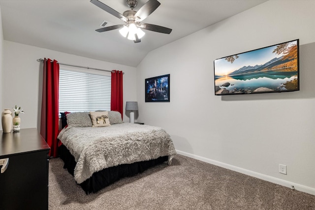 bedroom with ceiling fan, carpet floors, and lofted ceiling