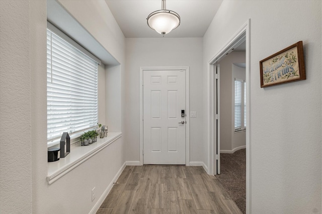 doorway featuring light wood-type flooring