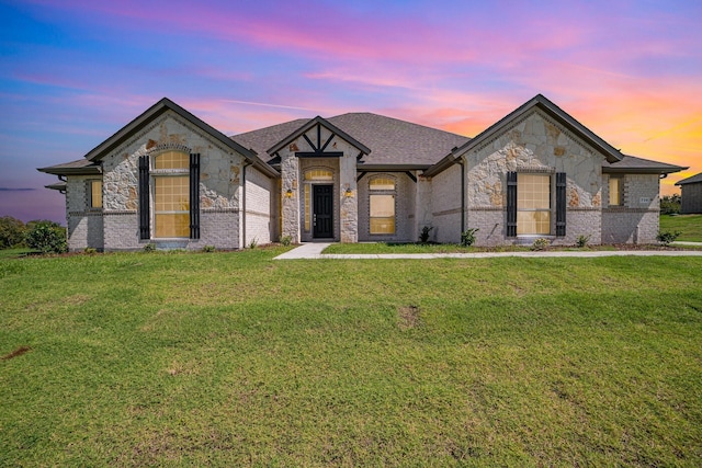 french provincial home with a yard