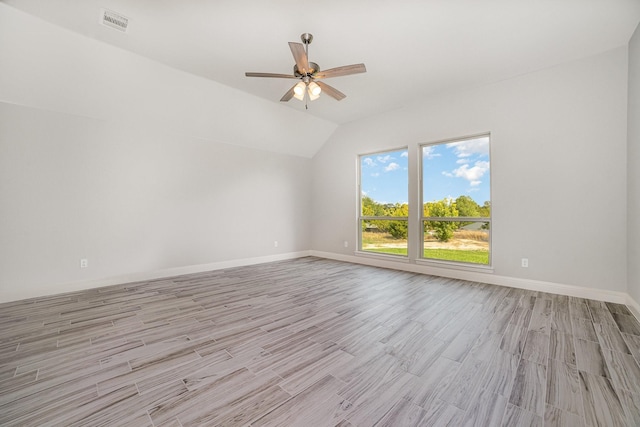 unfurnished room with light hardwood / wood-style flooring, ceiling fan, and lofted ceiling