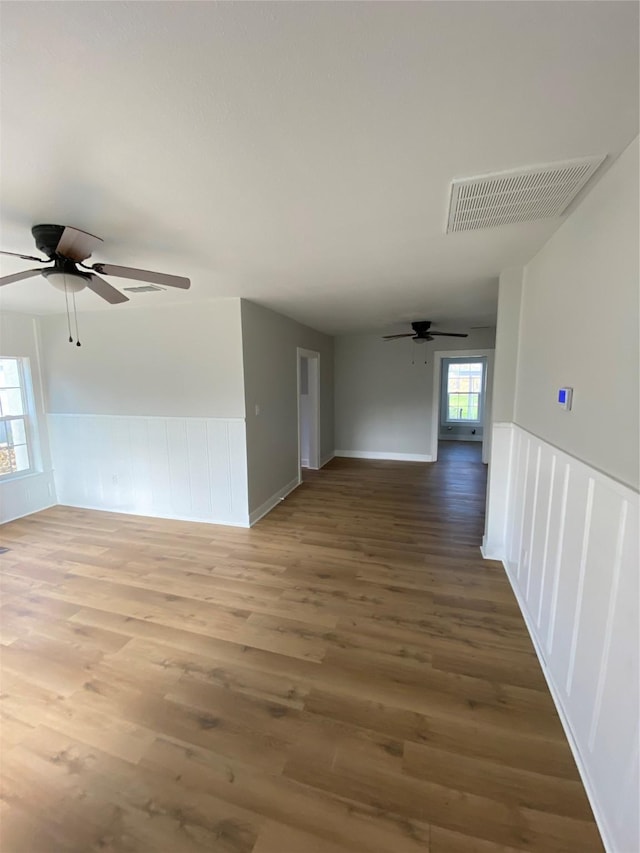 spare room featuring hardwood / wood-style flooring and ceiling fan