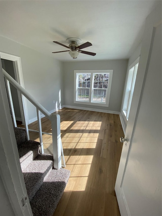 interior space with hardwood / wood-style flooring and ceiling fan