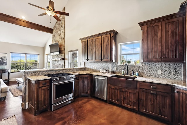 kitchen with appliances with stainless steel finishes, plenty of natural light, backsplash, and kitchen peninsula