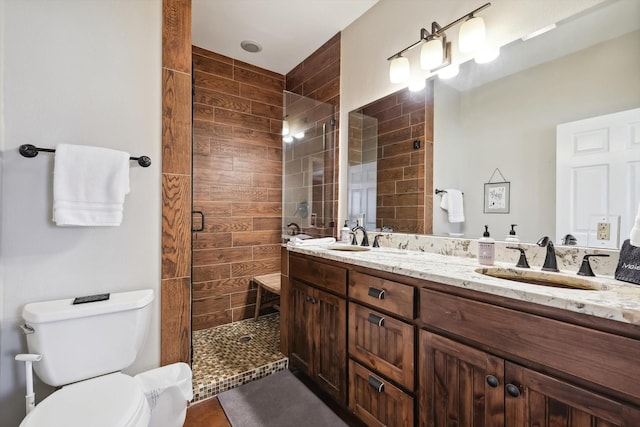 bathroom featuring vanity, toilet, and walk in shower