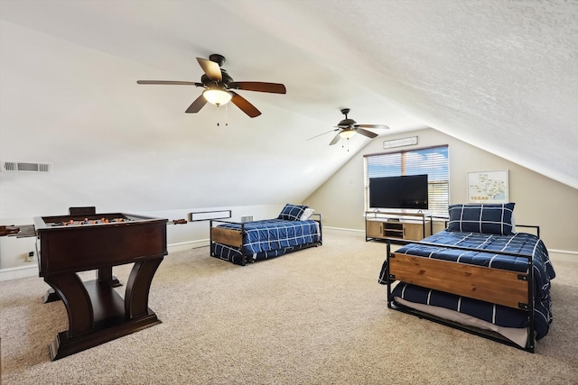 bedroom with vaulted ceiling, carpet, ceiling fan, and a textured ceiling