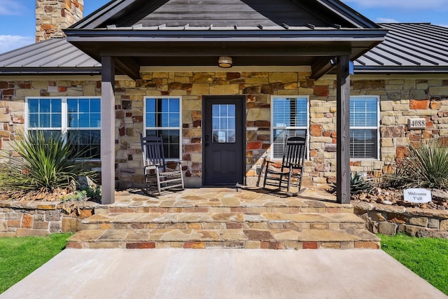 doorway to property featuring a porch