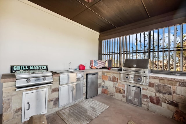 view of patio / terrace featuring area for grilling and exterior kitchen