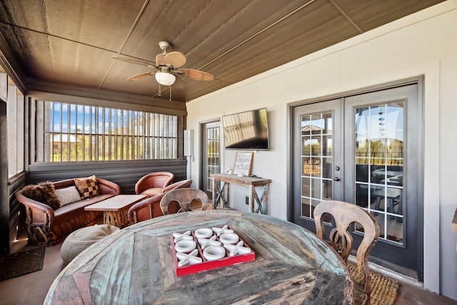 dining space with wood ceiling, french doors, and ceiling fan