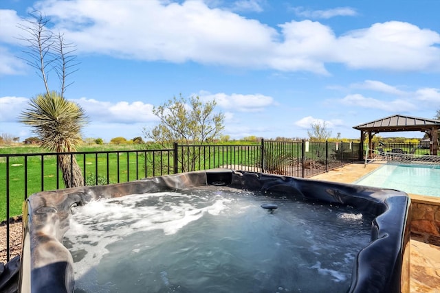 exterior space with a hot tub and a gazebo