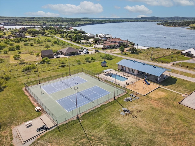 birds eye view of property with a water view