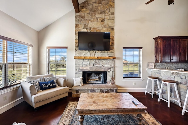 living room with a fireplace, high vaulted ceiling, dark hardwood / wood-style floors, and ceiling fan