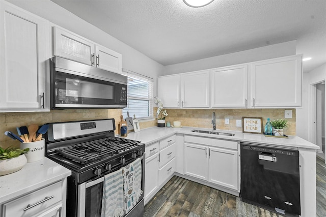 kitchen with white cabinetry, stainless steel appliances, dark hardwood / wood-style flooring, and sink