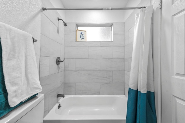 bathroom with shower / bath combo with shower curtain