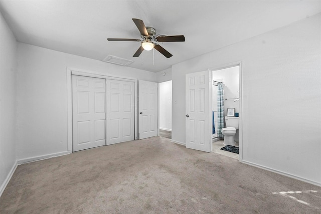 unfurnished bedroom with light carpet, ensuite bath, a closet, and ceiling fan